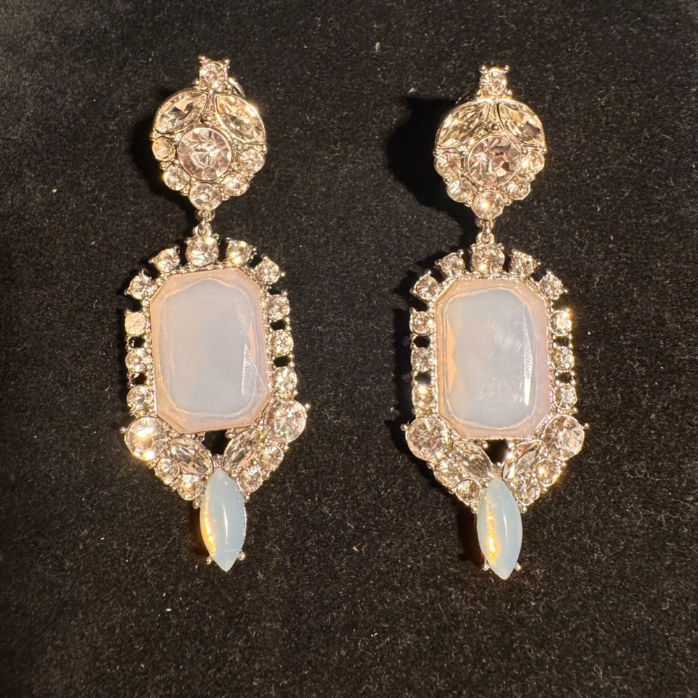Statement earring for silver lovers. Post back rhinestone and opal glass stone